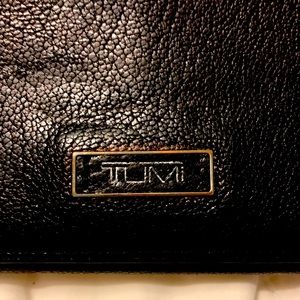Tumo black leather wallet.